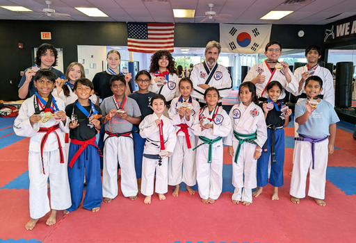 01-Flower Mound Taekwondo Students Pose with Medal